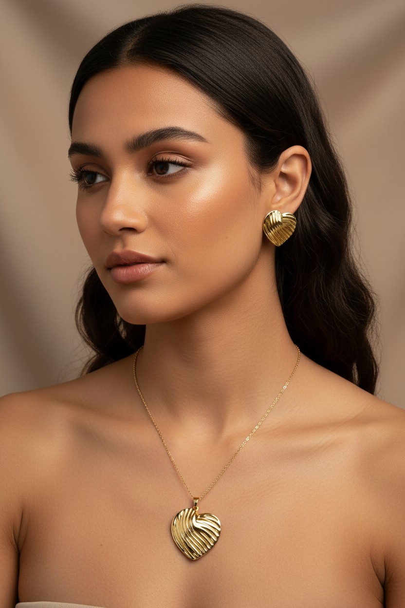 Model wearing the 18K Gold Plated Fluted Heart Pendant Necklace and Earring Set