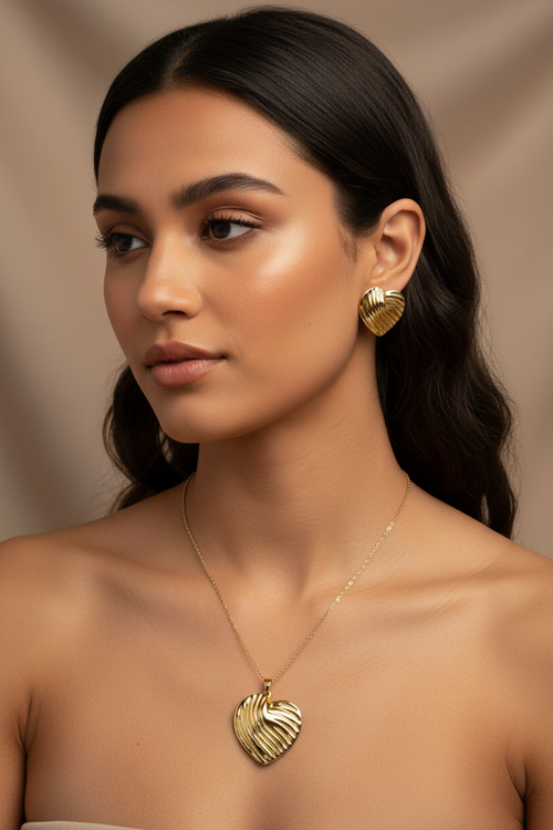 Model wearing the 18K Gold Plated Fluted Heart Pendant Necklace and Earring Set